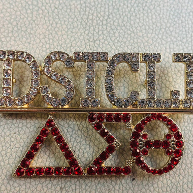 Chapter pin for Charlotte Alumnae Chapter of Delta Sigma Theta.