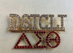 Chapter pin for Charlotte Alumnae Chapter of Delta Sigma Theta.